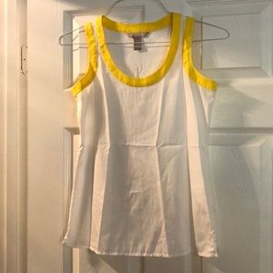 Yellow accent, white sleeveless shirt